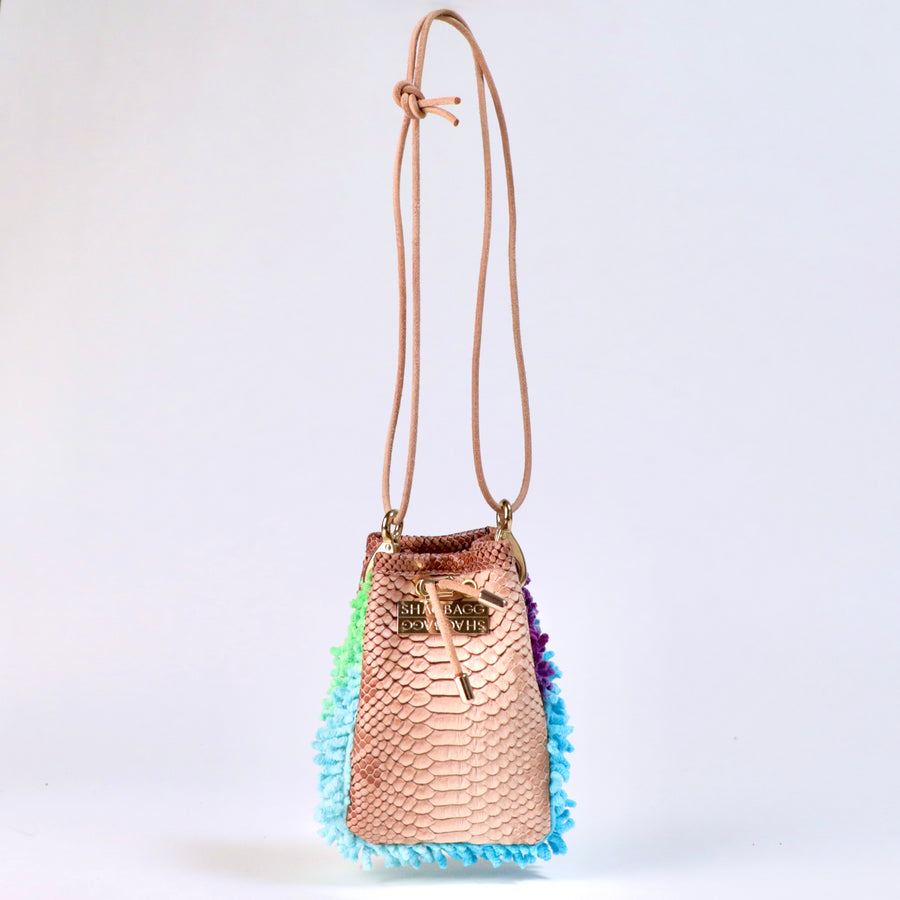 Rainbow Ranch Drawstring SHAG Mini featuring aqua, orchid, and green SHAG with tan faux python trim, gold-tone hardware, and a natural leather cord strap, handcrafted in Los Angeles
