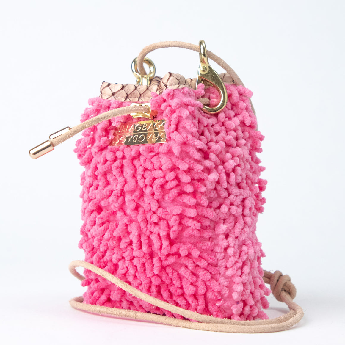 SHAGBAGG Drawstring Mini — Flamingo, neon bubblegum pink full SHAG crossbody bag with gold hardware and blush python collar, handmade Hollywood Los Angeles, front view