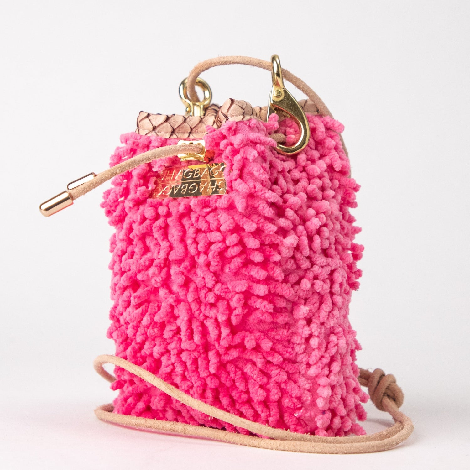 SHAGBAGG Drawstring Mini — Flamingo, neon bubblegum pink full SHAG crossbody bag with gold hardware and blush python collar, handmade Hollywood Los Angeles, front view