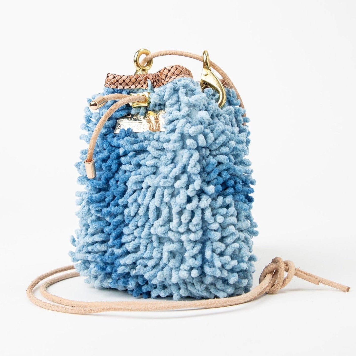 SHAGBAGG Drawstring Mini — Indigo Sister No. 2, two-tone cornflower blue full SHAG crossbody bag with gold hardware, handmade Hollywood Los Angeles, front view