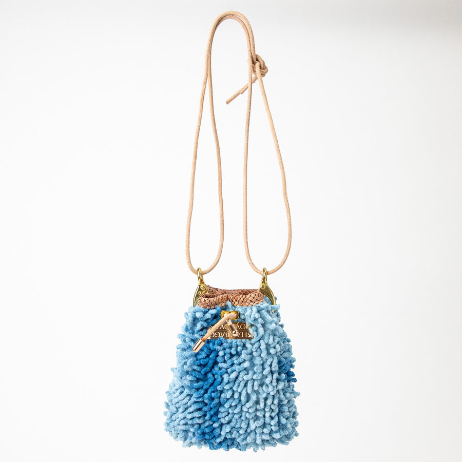 SHAGBAGG Drawstring Mini — Indigo Sister No. 2, two-tone cornflower blue full SHAG crossbody bag with gold hardware, handmade Hollywood Los Angeles, front view