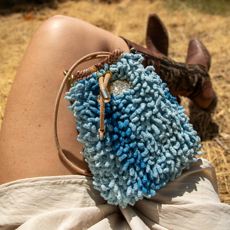 SHAGBAGG Drawstring Mini — Indigo Sister No. 2, two-tone cornflower blue full SHAG crossbody bag with gold hardware, handmade Hollywood Los Angeles, front view