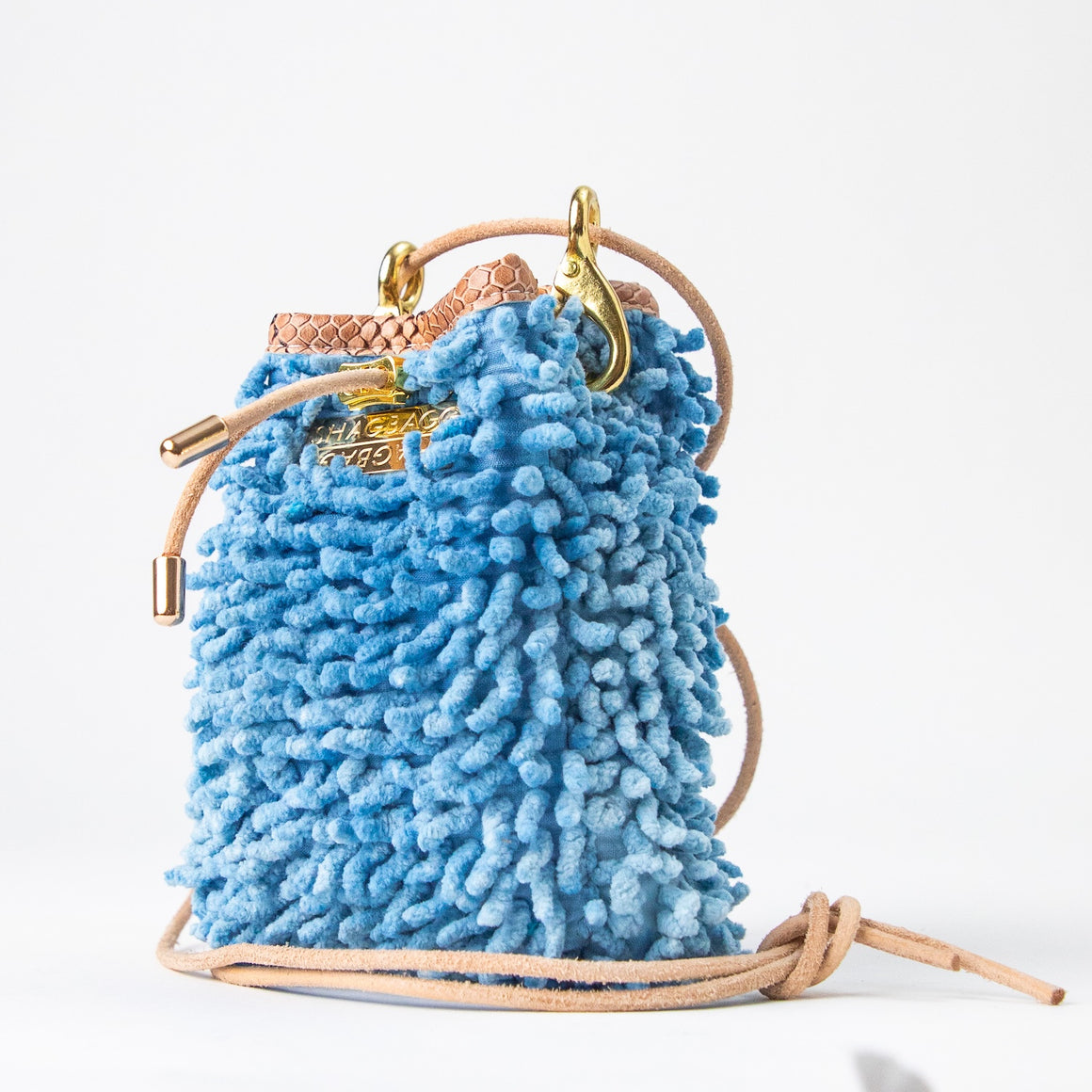 SHAGBAGG Drawstring Mini — Indigo Sister No. 3, vintage denim cornflower blue full SHAG crossbody bag with gold hardware and blush python collar, handmade Hollywood Los Angeles, front view