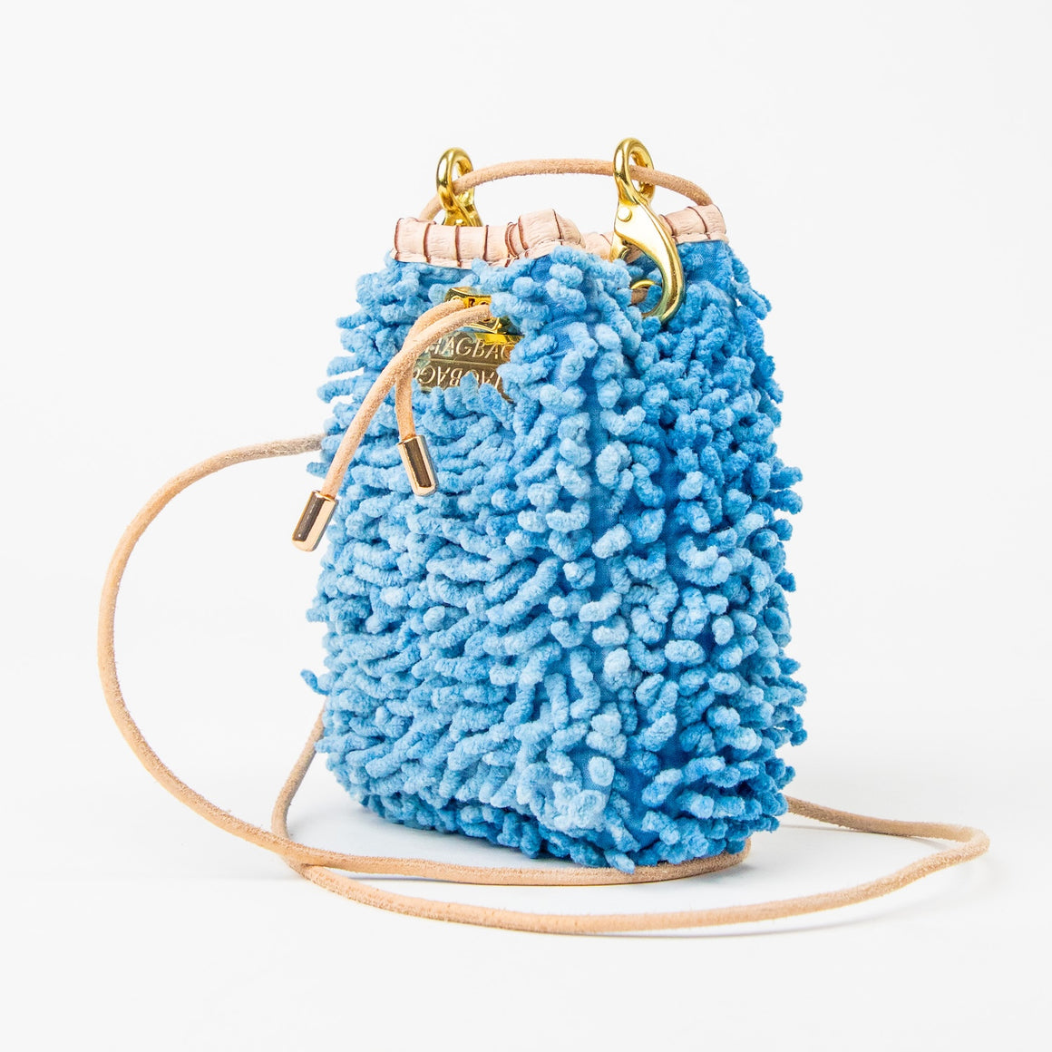 SHAGBAGG Drawstring Mini — Indigo Sister No. 1, cornflower blue full SHAG crossbody bag with gold hardware and blush croc collar, handmade Hollywood Los Angeles, front view