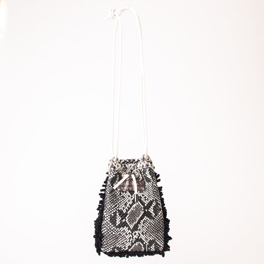 SHAGBAGG Drawstring Mini — Midnight black SHAG and black white faux python 3 panel crossbody bag with silver hardware and white leather cord, handmade Hollywood Los Angeles, front view