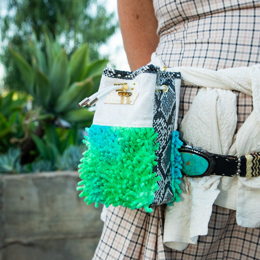 SHAGBAGG Mermaid Mini crossbody bag hanging — electric green and teal tie-dye SHAG, vintage lace, faux python, white leather strap, gold hardware
