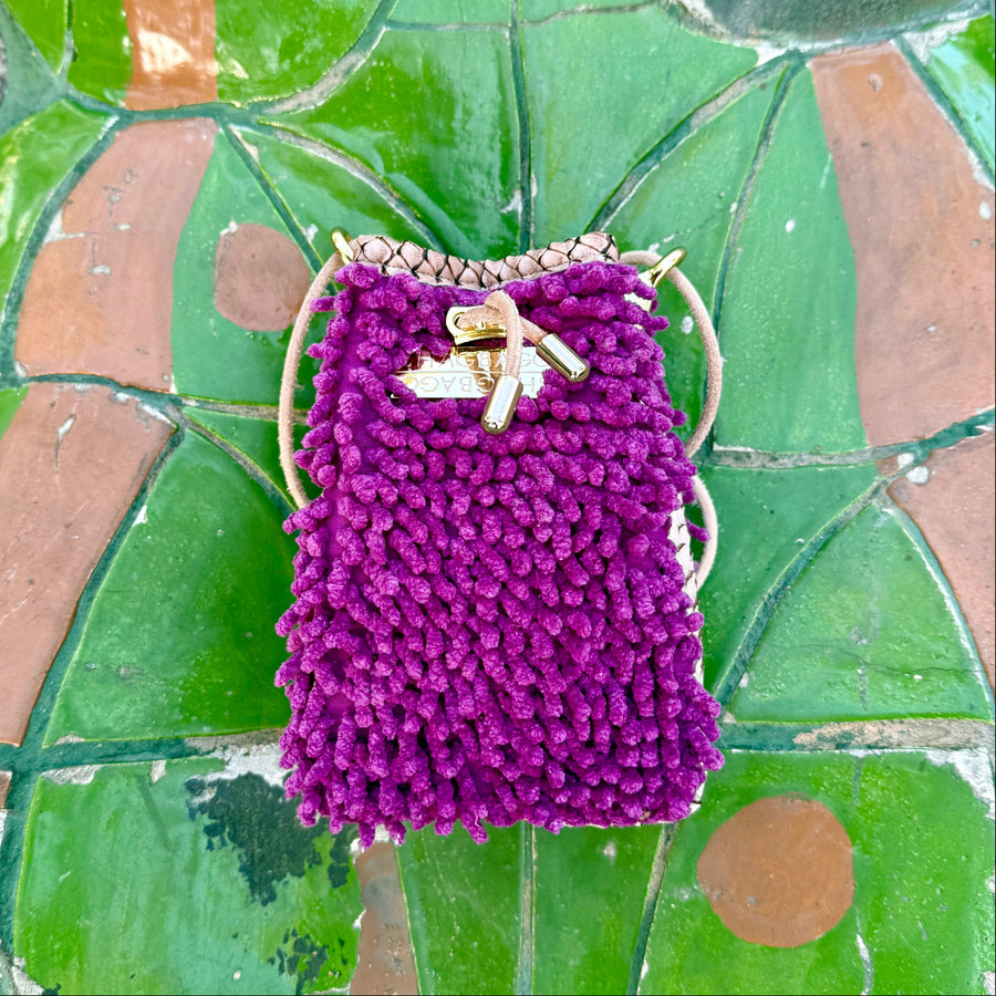 Orchid Ranch Drawstring SHAG Mini featuring orchid SHAG, tan faux python panels, gold-tone hardware, and a natural leather cord strap, handcrafted in Los Angeles.