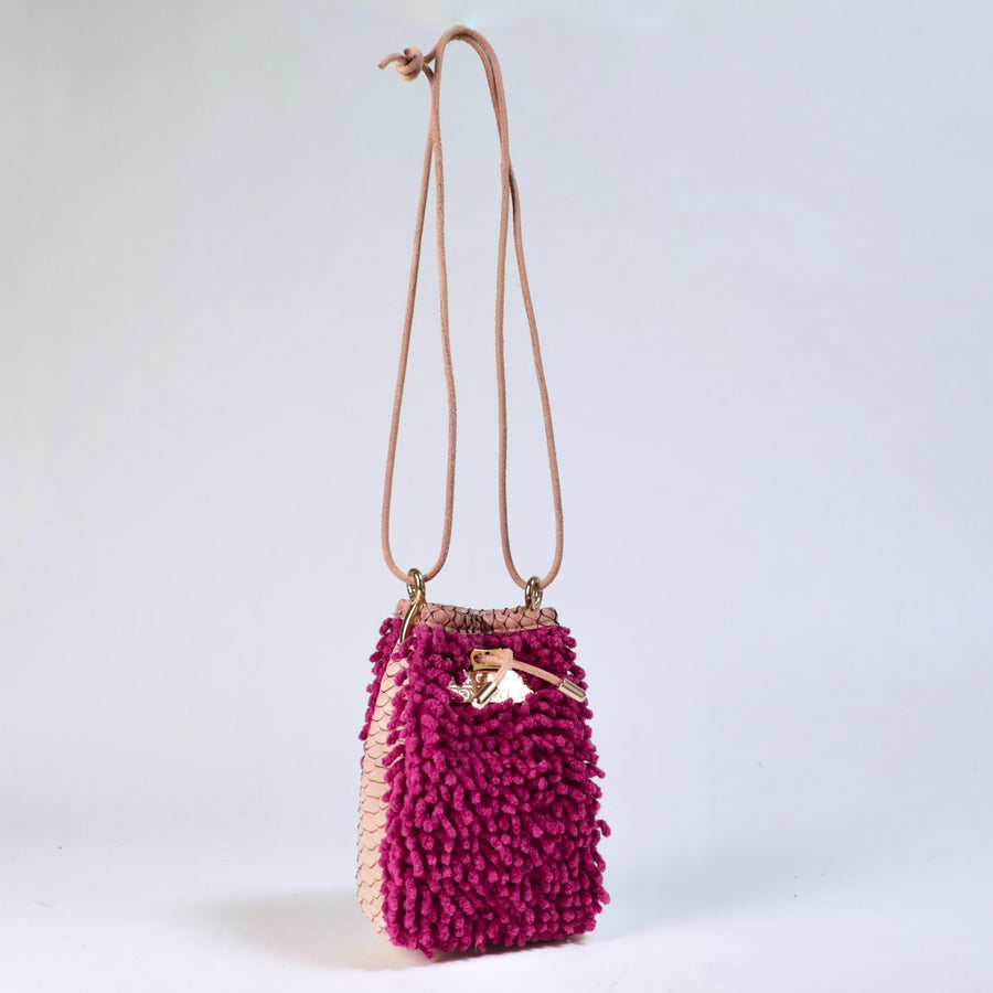 Orchid Ranch Drawstring SHAG Mini featuring orchid SHAG, tan faux python panels, gold-tone hardware, and a natural leather cord strap, handcrafted in Los Angeles.