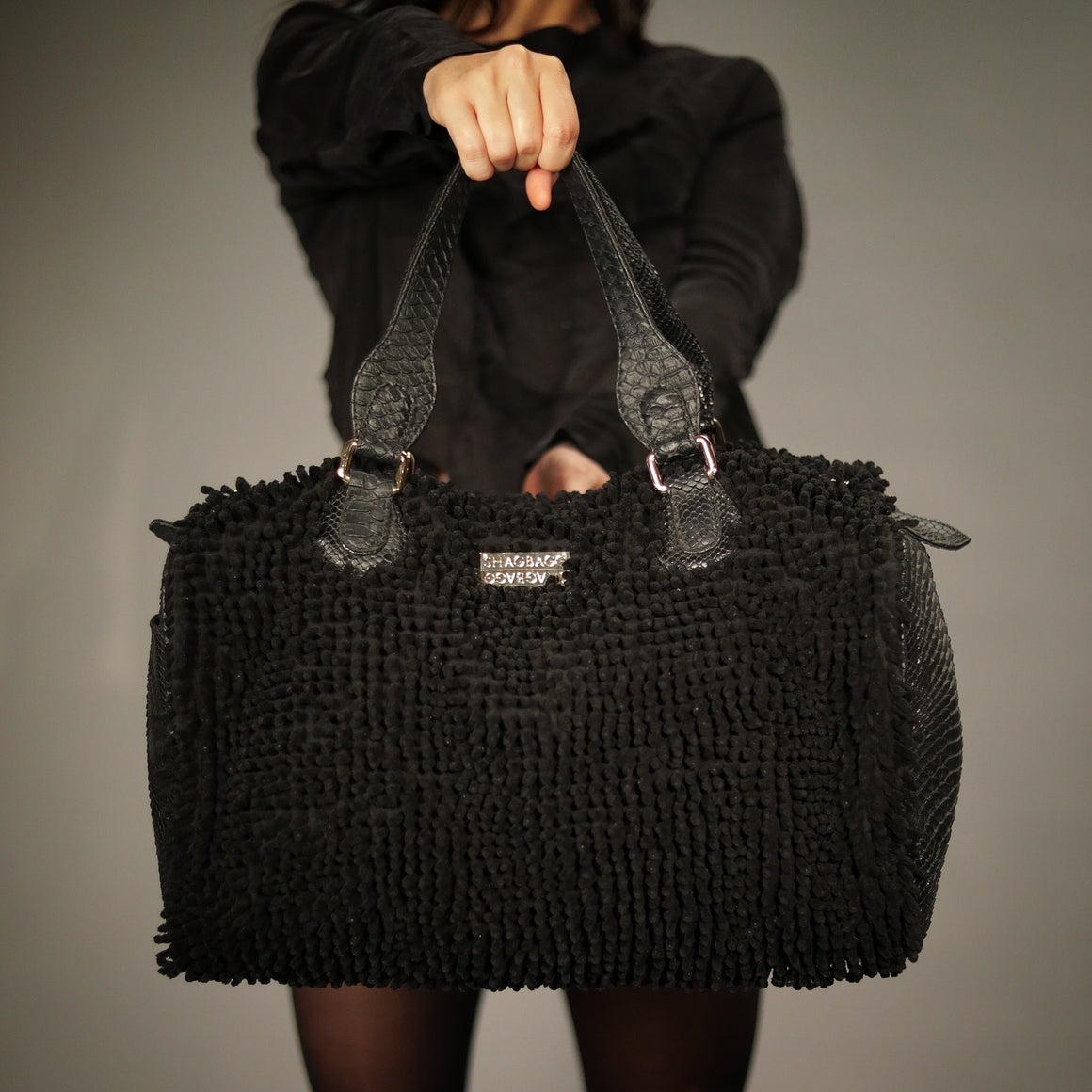 Front view of the SHAGBAGG Overnight SHAG Tote with faux-python panel and shag detailing.