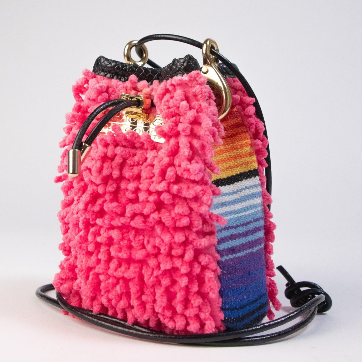 One-of-one hot pink SHAG mini drawstring bag featuring vintage woven textile panel and gold-tone hardware