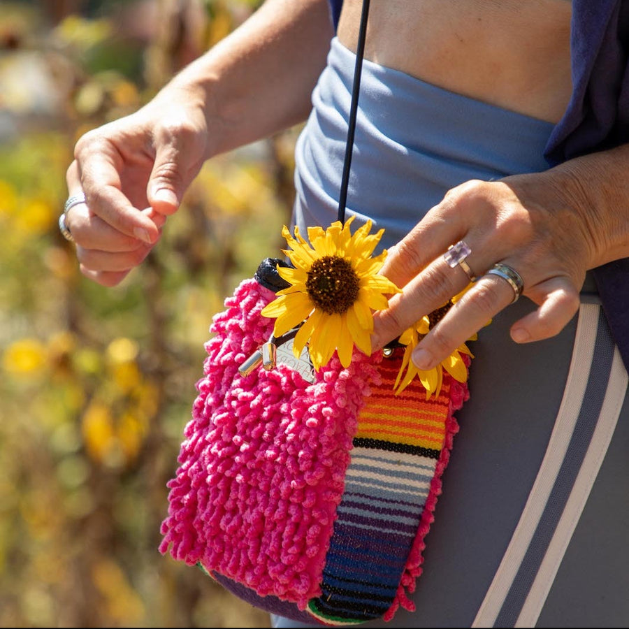 One-of-one hot pink SHAG mini drawstring bag featuring vintage woven textile panel and gold-tone hardware