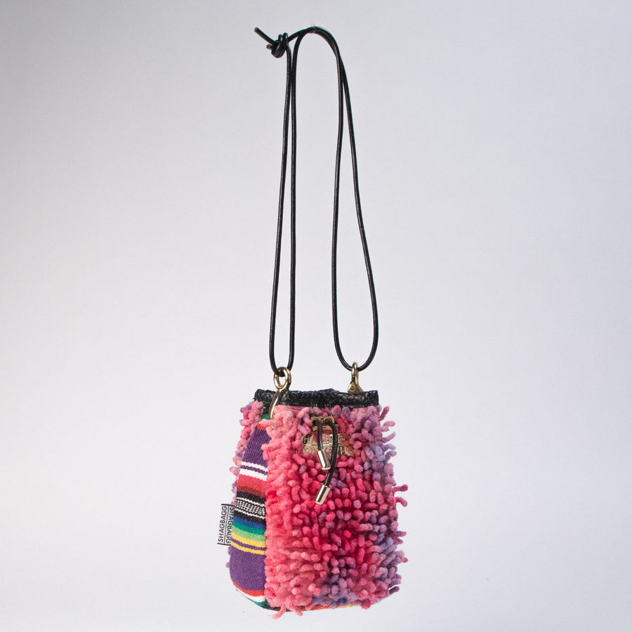 Hand-dyed SHAG Drawstring SHAG Mini with vintage woven textile panel, gold hardware, and black leather cord strap handcrafted in Los Angeles